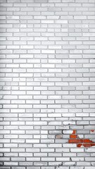 Gray brick wall with small patch of red bricks showing through in disrepair, slightly textured