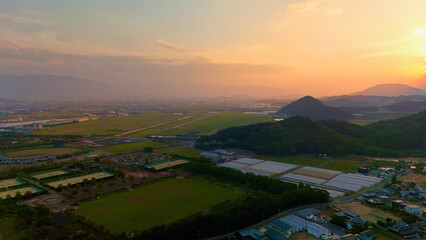 Obaru Beach and Nagahama Beach, Imazu, Nishi Ward, Fukuoka, Japan: Aerial Drone View of Sunset Coastline, Mountains, Forests, Farmland, Coastal Houses, Estates and Karatomari Park