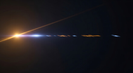 Fototapeta premium Sunset Streaks Across Dark Sky with Light Trails