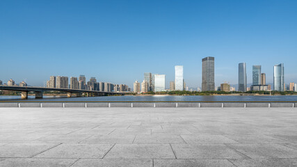 Modern City Skyline with River and Bridge © zhouyilu