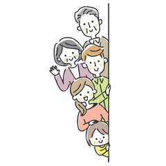 壁から笑顔で顔を出す家族