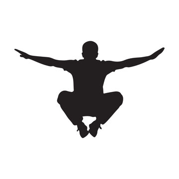Black silhouette of a parkour athlete jumping in mid-air with wide arms and tucked legs.