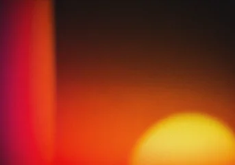 Selbstklebende Fototapeten Rot Warm Leak Light Background with Abstract Gradient and Vintage Film Effect  © MDSafwan