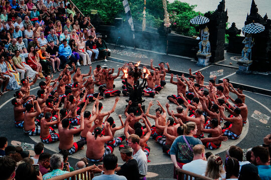 Traditional Balinese Kecak Dance Performance at Sunset with Audience
