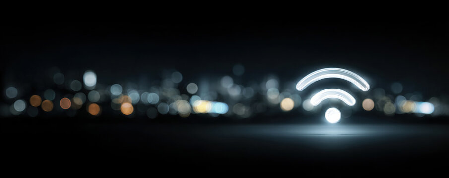 Abstract wifi signal icon glowing over blurred night city lights digital background