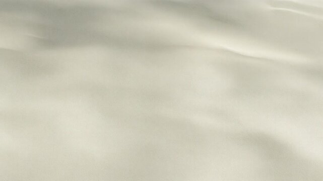 Expansive textured surface resembling weathered plaster or fine sand in soft tones