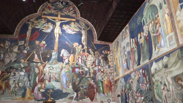 Gothic 14th-century oratory in Urbino, famous for stunning 1416 frescoes by Salimbeni brothers, including a vast Crucifixion and scenes from Saint John the Baptist's life