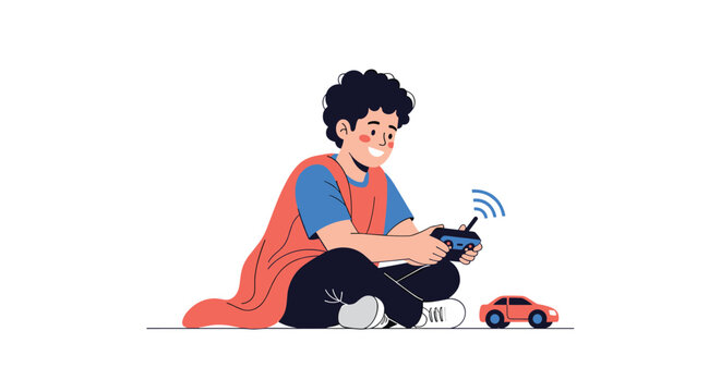 Joyful young boy wearing a superhero cape plays with a red remote control car while sitting on the floor having fun.