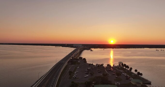  Aerial Drone View of Titusville Florida Bridge Connecting Coastlines at Sunset on December 28, 2025