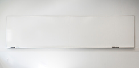 white board hanging on the wall