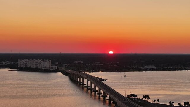 Aerial Drone View of Titusville Florida at Sunset With Bridge Over Indian River Lagoon