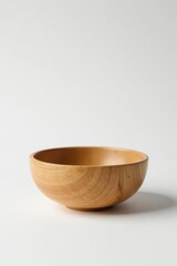 A Simple, Light Brown Wooden Bowl on a White Background for Culinary or Decorative Purposes