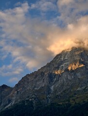 Mountain Peak Shrouded in Glowing Sunset Cloud