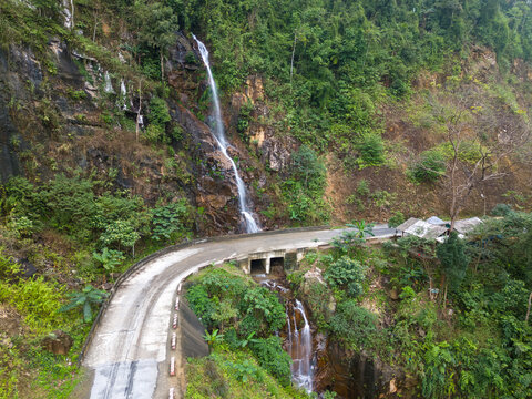 Roadside Waterfall Along Mountain Road in Vietnam