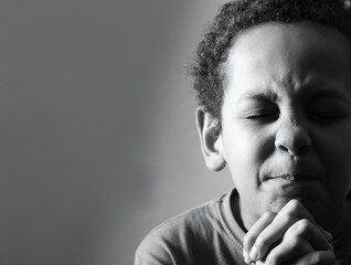 little boy praying to god with hands together worshiping God with people stock image stock photo	