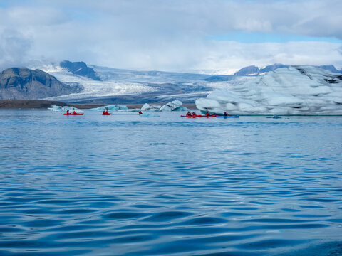 Group of kayakers in Iceland's Jokulsarlon Glacier Lagoon