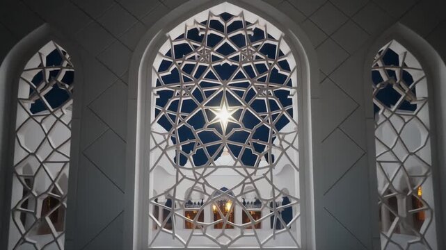 Traditional Arabic geometric star patterns and arabesque ornaments gently moving behind a white