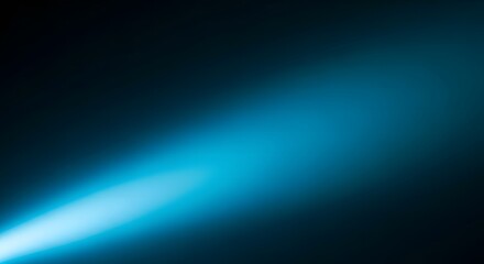 Obraz premium A bright blue light beam shining through darkness