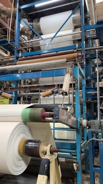 Side view of mercerizing machine running in textile production line