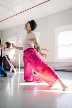 Diverse women enjoying dance ribbon rhythmic gymnastics class