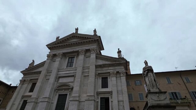 A view of the facade of the Cathedral of Santa Maria Assunta in the historic center of the city of Urbino, Marche region, Italy