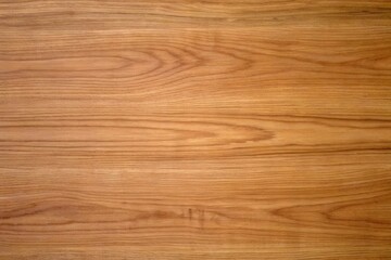 Fototapeta premium natural warm medium golden brown oak wood plank texture with prominent horizontal wavy grain lines subtle small dark knots fine natural variations smooth polished surface background for rustic luxury 