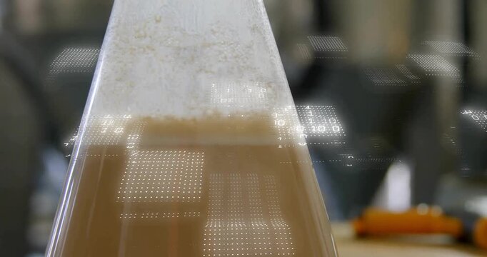 Bubbles causing foam rising conical flask film-wrapped, technician peeling wrap to reveal residue