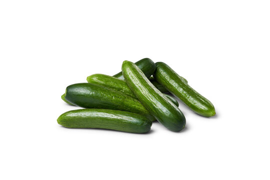 Fresh green mini cucumbers piling on transparent background