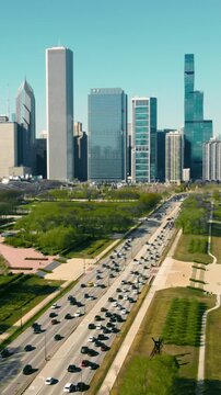 Aerial view Downtown Chicago and Lake Michigan on a sunny day. Vehicle traffic per day moving along the highway