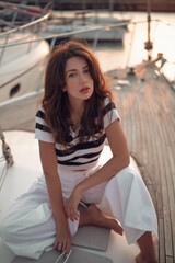 Obraz premium Moonlit Marina Portrait Of A Woman On Boat
