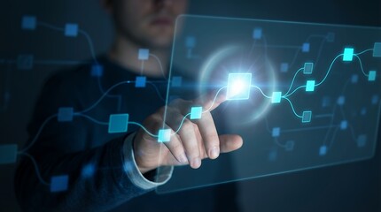 A person's hand touches a luminous digital interface displaying a network of interconnected blue squares and glowing lines in a futuristic concept technology connection data innovation