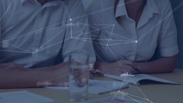 Animation of connections over midsection of diverse designers talking and working
