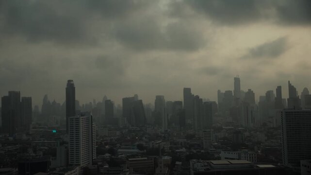 Cityscape of Bangkok covered by mixture of dust in air pollution. Heavy air pollution of fine particulate matter (PM2.5) in morning.