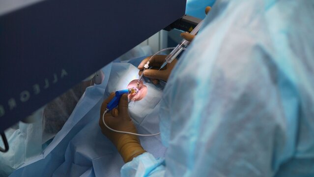 Surgeon performing laser vision correction surgery in clinic
