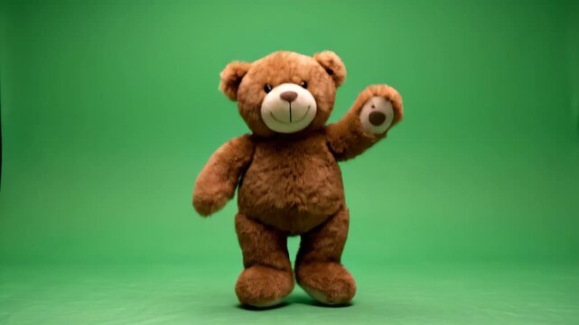 Animated brown teddy bear waving its paw on a green screen background for compositing child friendly projects and creative designs