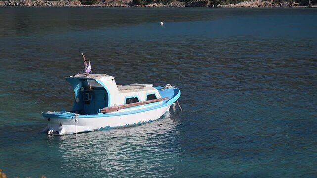 Boat closeup on calm water near Panormitis Monastery in Symi