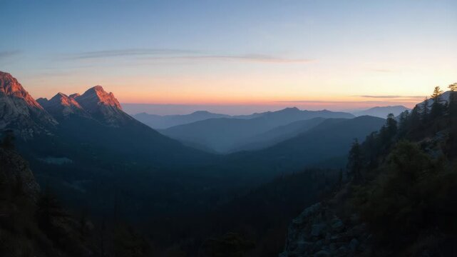Sunrise mountain valley mist with layered ridges and warm pastel sunset glow peaceful blue