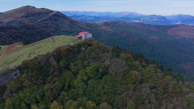 Aerial view from a drone of Mount Coliza (897 m) (Kolitza in Basque) with the chapel of San Sebasti&aacute;n and San Roque in the Ordunte Mountains in Valmaseda. Bizkaia, Basque Country, Spain.