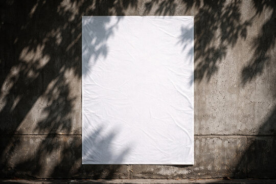 Blank white poster paper glued on a weathered grey concrete wall mockup with urban street shadows.