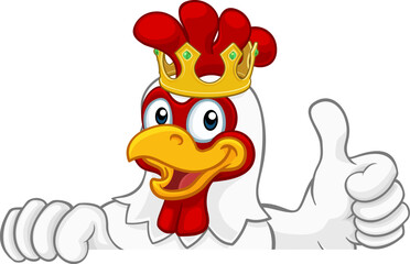 Fototapeta premium A chicken rooster cockerel bird cartoon character in a gold kings crown peeking over a sign and giving a thumbs up