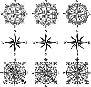 Set of vintage compass rose silhouettes with nautical direction markers, classic navigation windrose icons isolated on white background for travel, map, and maritime design concepts