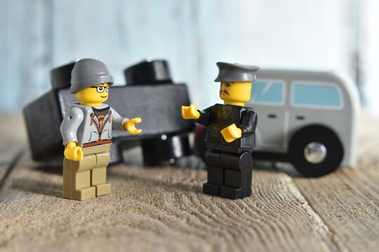 Lego toy police Inspecting  Car For  Damage After Accident