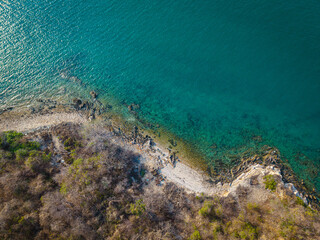 Aerial view white sand beach wave tropical island turquoise water