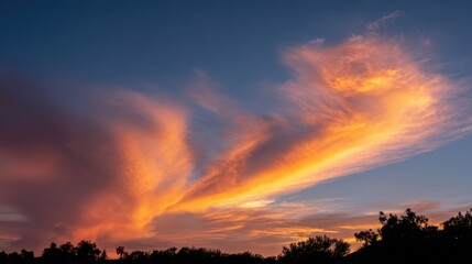 Obraz premium Dramatic sunset clouds with layered fiery sky formations