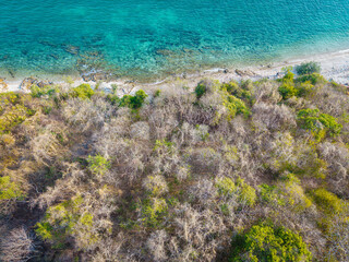 Aerial view white sand beach wave tropical island turquoise water