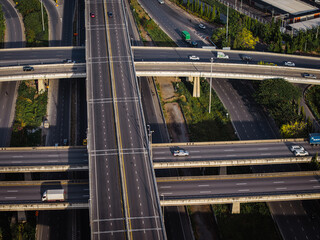 Aerial view city transport junction cross modern road morning light with vehicle movement