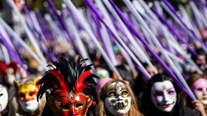 Large Purim parade with people wearing colorful masquerade masks celebrating Jewish festival in vibrant outdoor crowd

