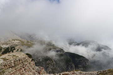 Alpine massif close‑up shrouded in white clouds