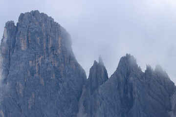 Jagged Dolomites peaks cloaked in ethereal mist