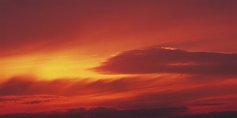 Fototapeta premium Vibrant sunset with rays of light peeking through dark clouds in the sky